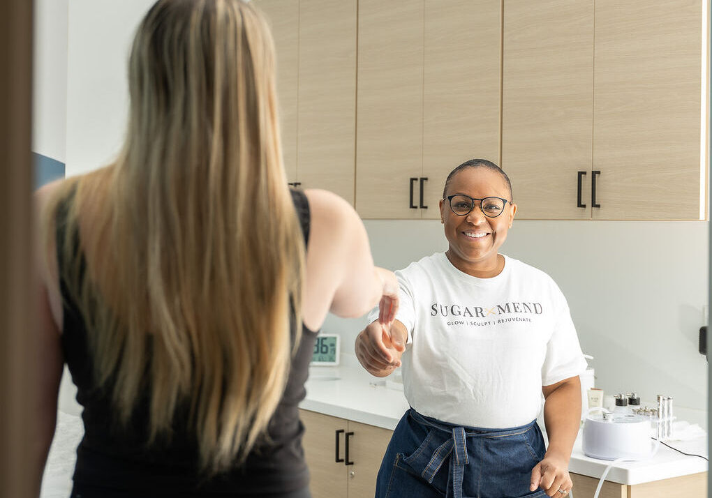 A warm welcome at Sugar and Mend, establishing trust before a holistic hair removal session.